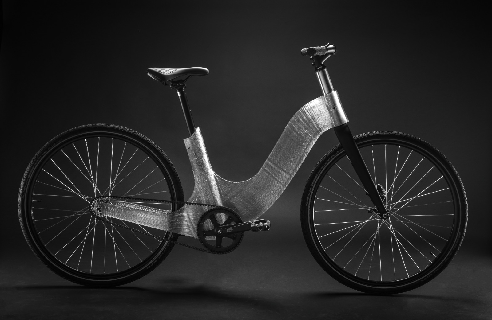 Polycarbonate 3D printed bike frame as part of a functional bike on a blank background